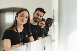 Group team portrait of colleagues smiling together indoors