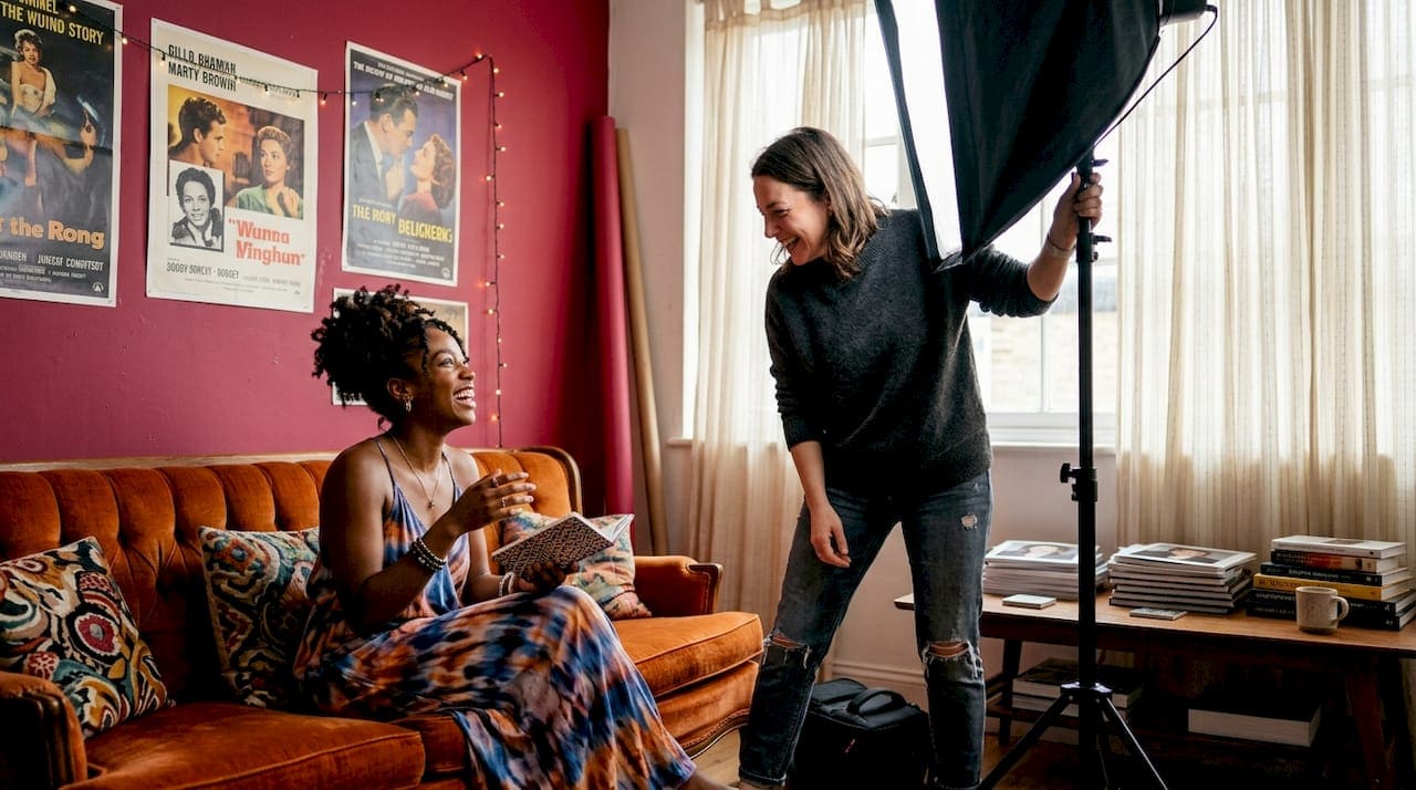 Photographer working with model on creative headshot